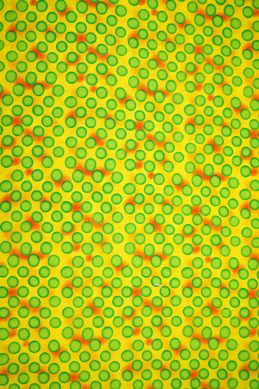 Baumwolle leuchtend gelb mit grünen Kreisen
